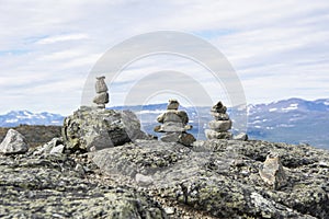 Stone towers on the rocks and mountain view on the background, Saana, Enontekio, Kilpisjarvi, Lapland, Finland