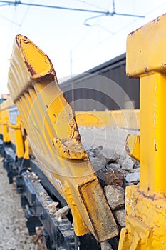 Stone transport freight train wagon in railway depot