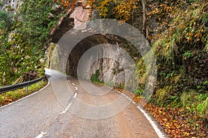 Stone tunnel road in mountain scenary in Somiedo natural park, Asturias, Spain