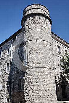 A stone turret and medieval buildings