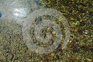 Stone under crystal clear water of  Ganga River