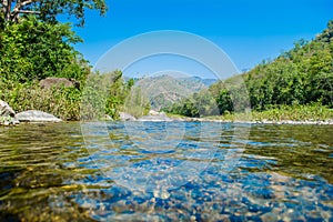 Stone under crystal clear water of  Ganga River