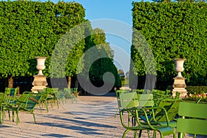 Stone urns and empty chairs in the Tuileries garden, Paris
