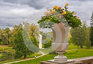 Stone vases with flowers in Pavlovsky Park, Russia St. Petersburg