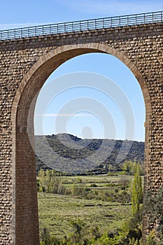 Stone viaduct in Albentosa, Teruel. Spain. Green way.