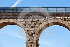 Stone viaduct detail in Albentosa, Teruel. Spain. Green way.