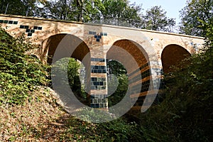 Stone viaduct in the park Muskauer