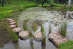 Stone walkway over the water.