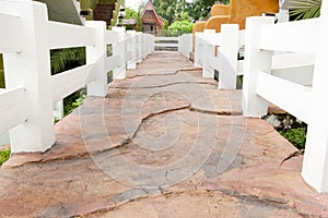 Stone walkway in the park with green grass