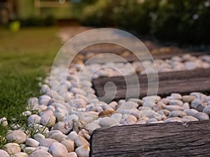 Stone walkways in the backyard, low and night light.