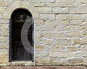 Stone wall with antique door