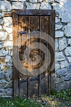 Stone wall and antique wooden door