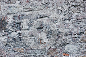 Stone wall background closeup, horizontal plastered grunge red grey beige stonewall limestone pattern, old aged weathered gray