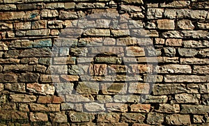 Stone wall background on earth tone