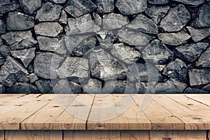 Stone wall background and empty wooden table display montage for