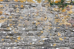 Stone wall background with lichens