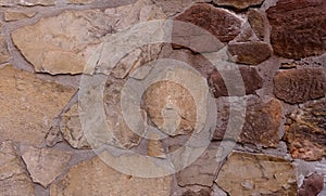 Stone Wall Background.Old Castle Stone Wall Texture Surface,Part of Real Natural Brick and Granite Wall in Light Brown,Dark Brown