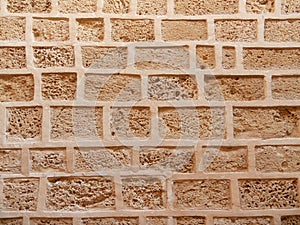 Stone wall background, porous stone texture