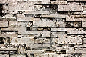 Stone wall background. Stone wall that combines many types of stone together. Texture seamless.