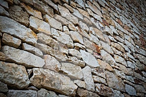 Stone wall background with vignetted borders