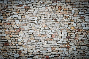 Stone wall background with vignetted borders