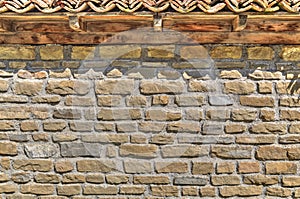 Stone wall background with wooden beams and tiles