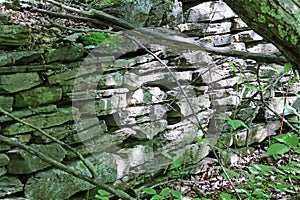 Stone wall with barbed wire