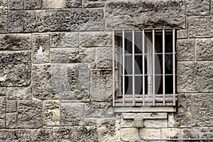 Stone Wall and barred window of Spanish Mission Espada