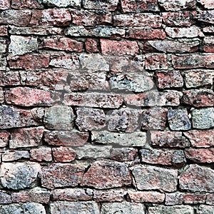 Stone wall closeup, stonewall pattern background, old aged weathered red and grey grunge limestone dolomite calcium hard slate