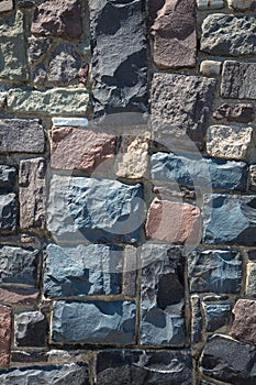 Stone wall from cobblestone background vertical