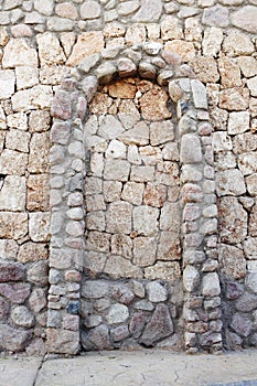 Stone wall with corbel arch
