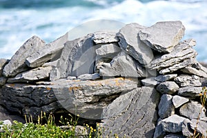 Rocks and vegetation on Doolin beach, county Clare, Ireland photo