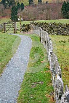 Stone wall fence and kissing gate.