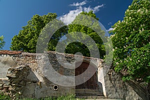 Stone wall of a fortified church in Transylvania, in Spring time
