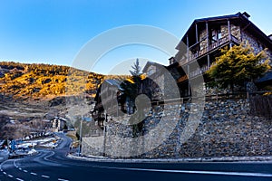 Stone wall and houses or apartments in El Tarter village, Andorra