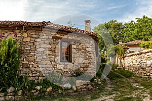 A stone wall and an old house from Arbanasi, Bulgaria.