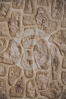 Stone wall pattern as texture and background for design. Close up view of old wall texture.