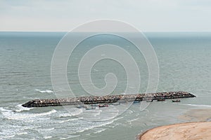 Stone wall protect wave in the sea