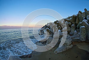 Stone wall by the sea, boulders