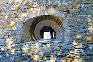 Stone wall of stronghold with embrasure