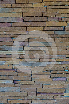 The stone wall texture background natural color.Background of stone wall texture photo.
