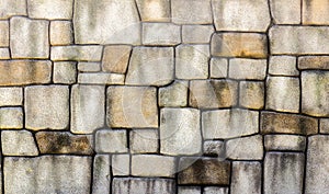 Stone wall texture background, pattern natural color of modern style design decorative uneven cracked real stone wall surface with