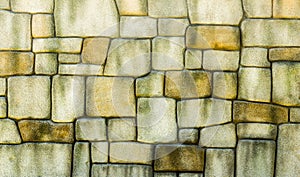 Stone wall texture background, pattern natural color of modern style design decorative uneven cracked real stone wall surface with