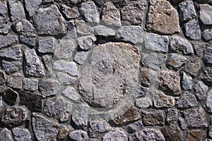 Stone wall, texture. Granite stones of different sizes, masonry. Background