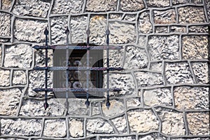 Stone wall texture with old medieval window