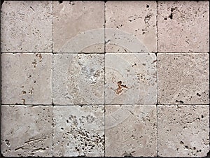 Stone wall texture, travertine tiles facing photo