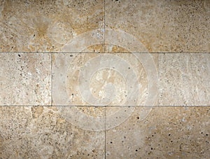 Stone wall texture, travertine tiles facing photo