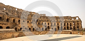 Stone walls with arched passageways of El Jem Amphitheatre, Tunisia