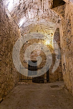 The stone walls of the casemates in an ancient fortress in Savona, Italy