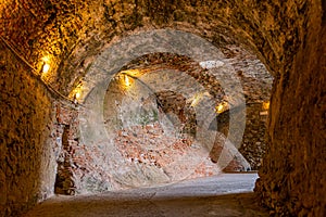 The stone walls of the casemates in an ancient fortress in Savona, Italy